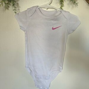 Nike White Baby Bodysuit with Pink Swoosh